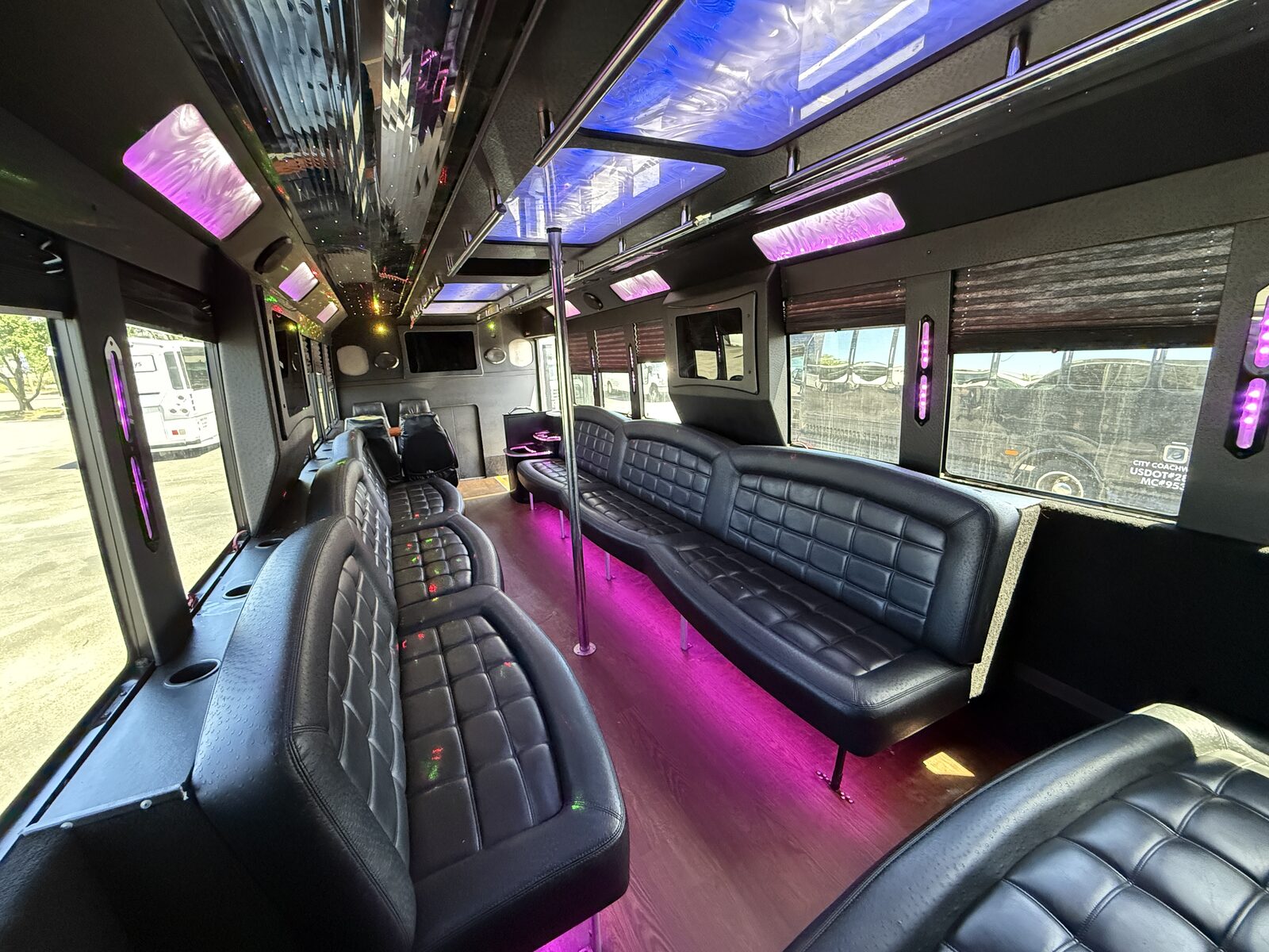 Luxury leather party bus interior with color-changing LED lighting