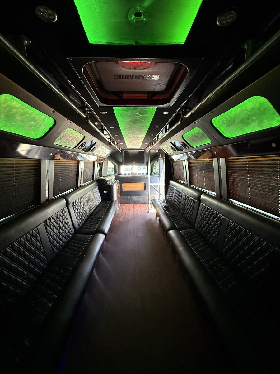 Glam party bus interior with diamond-stitch panels and LED lighting
