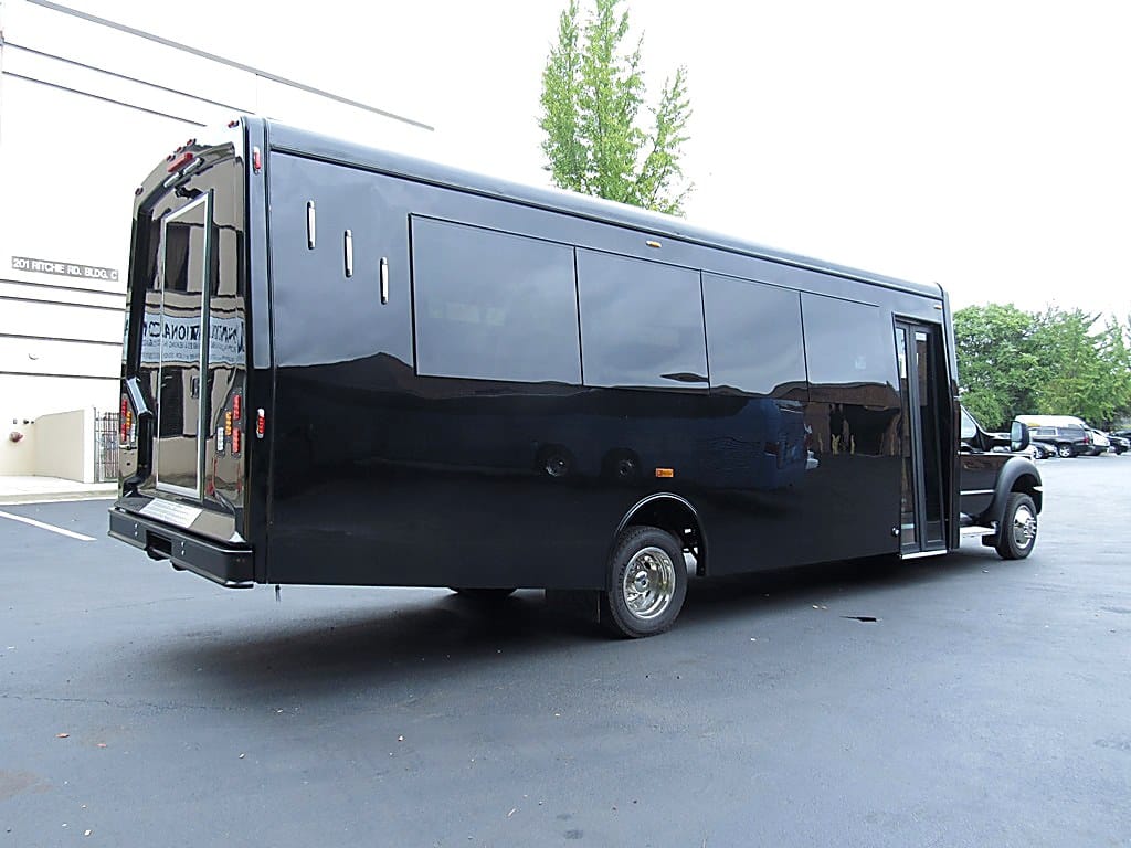 Group boarding a Party Bus R Us limo bus
